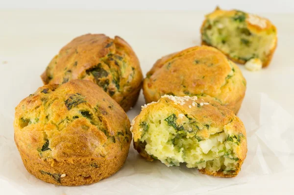 Corn bread with spinach on a wooden table — Stock Photo, Image