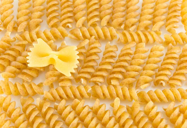 Bunch of sprial golden colored macaroni pasta — Stock Photo, Image