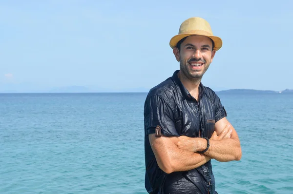 Happy wet man at the seaside. Summer fan — Stock Photo, Image