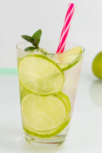 Cold green lime juice with ice cubes — Stock Photo, Image