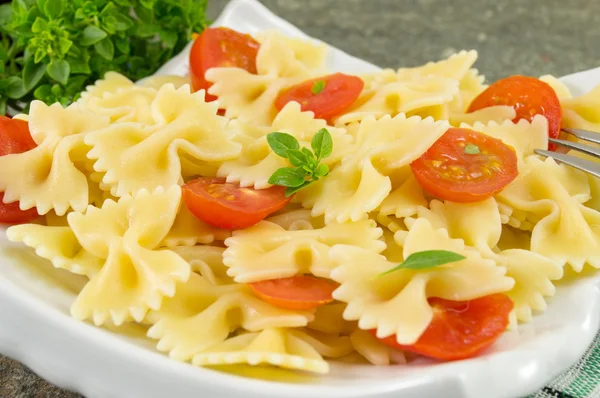 Bow tie farfalle pasta served on a plate — Stock Photo, Image