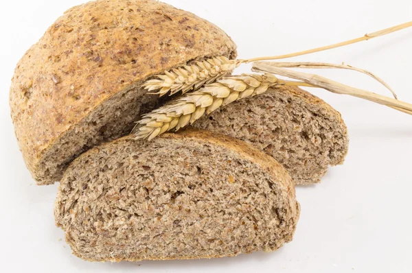 Home baked brown bread slices on the table — Stock Photo, Image