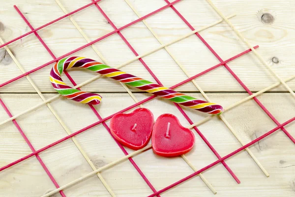 Colorful candy cane and heart shaped candles — Stock Photo, Image