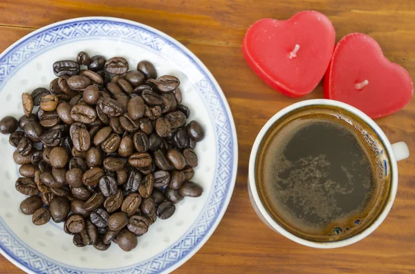 Cup of Turkish coffee and heart shaped candles — Stock Photo, Image