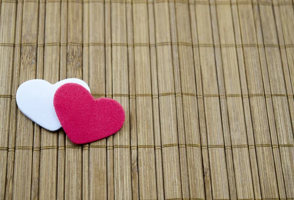 Red heart and white heart on a Japanese table — Stock Photo, Image