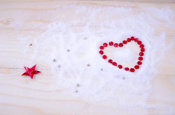 Heart shaped out of red star ornaments — Stock Photo, Image