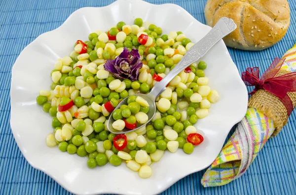 Plate full with cooked peas corn and pepper — Stock Photo, Image