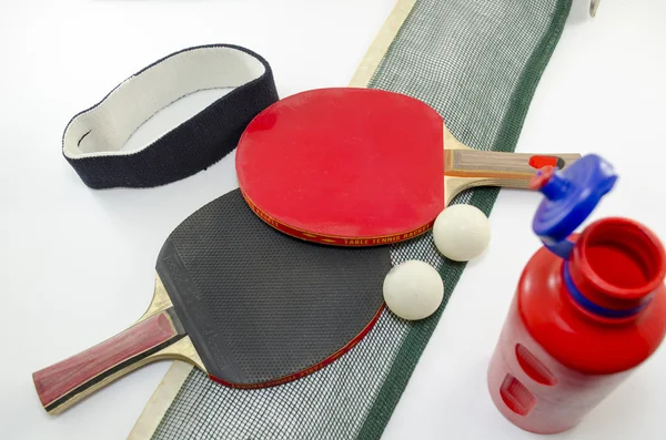 Two table tennis rackets and a net isolated — Stock Photo, Image