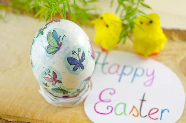 Hand painted decoupage Easter egg on a wooden surface — Stock Photo, Image