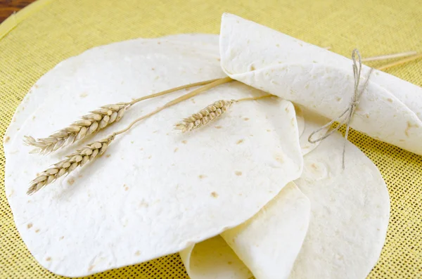 Bunch of tortillas and a stick of wheat — Stock Photo, Image