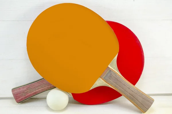 Two table tennis rackets and a ball — Stock Photo, Image