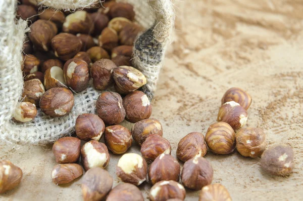 Hazelnuts in a vintage bag — Stock Photo, Image