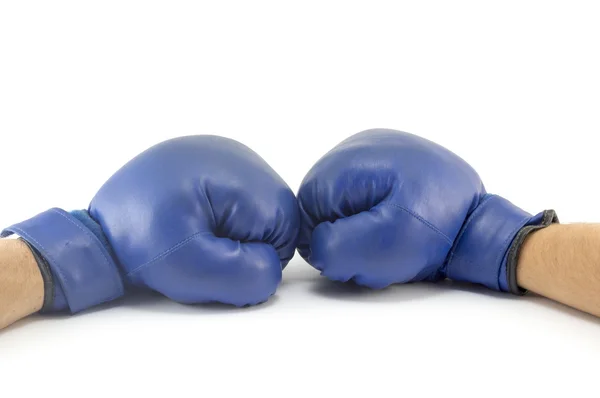 Two fists in blue boxing gloves confronting at each other — Stock Photo, Image