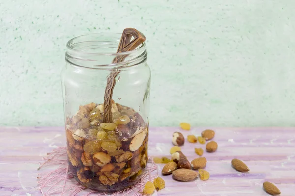 Jar of honey with choped nuts, almond and hazelnuts — Stock Photo, Image