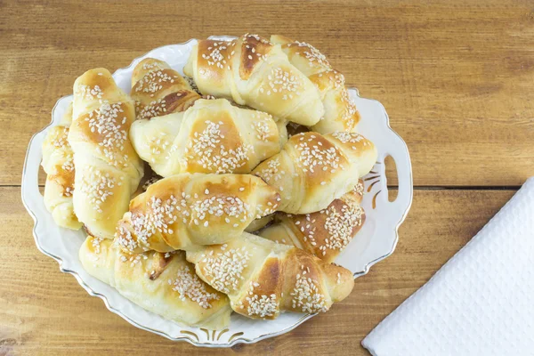 Homemade pastry with sesame on the white plate — Stock Photo, Image