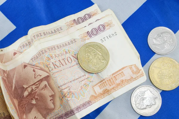 Grecki stare banknoty drachmy waluty na grecką banderą — Zdjęcie stockowe