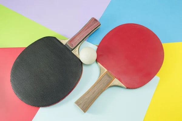 Pair of table tennis rackets on a collage background — Stock Photo, Image