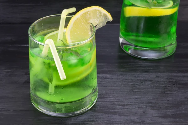 Homemade mojito in a glass on against dark background — Stock Photo, Image