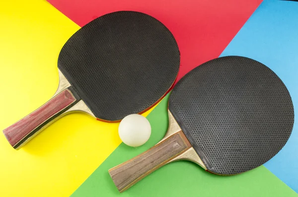 Pair of table tennis rackets on a collage background — Stock Photo, Image