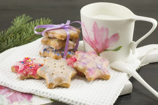 Home baked and decorated Christmas cookies and glass of milk — Stock Photo, Image