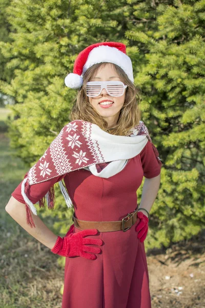 Portrait of a beautiful Santa Claus girl with party glasses — Stock Photo, Image