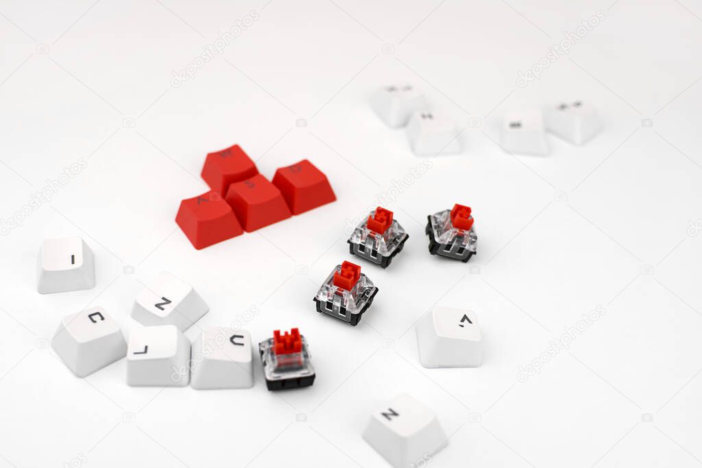 Mechanical keyboard switch on a white background. WASD keyboard buttons. Concept of computer games, gaming and esports.