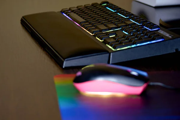 Gaming keyboard and mouse with backlight. RGB backlit keyboard and mouse, selective focus.