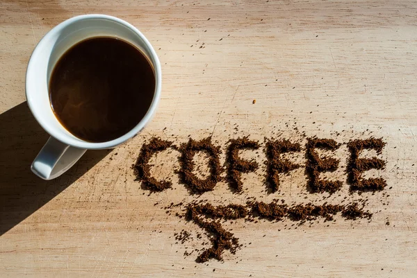 Coffee on a wooden table — Stock Photo, Image