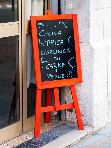 An advertising blackboard outside an italian restaurant — Stock Photo, Image