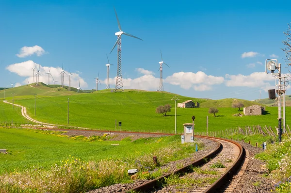 Railway and windmills in the countryside — Stock Photo, Image