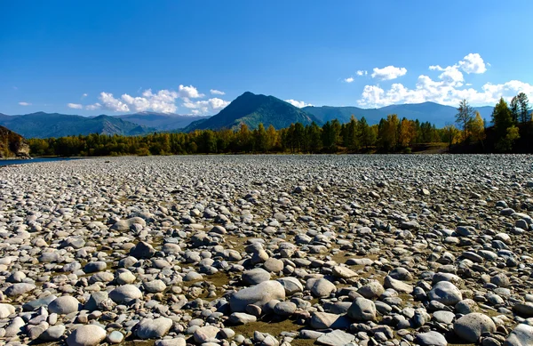 View of the parched bed of mountain river covered with stones — Stock Photo, Image