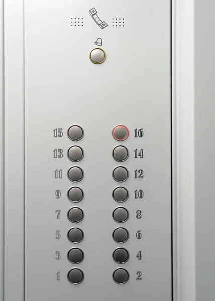 Μεταλλικά ελέγχου ασανσέρ με στρογγυλή κουμπιά με τους αριθμούς των δαπέδων Royalty Free Εικόνες Αρχείου