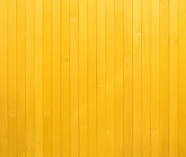 Felületre (fal) a sárga fa léc, függőlegesen elrendezett töredéke — Stock Fotó