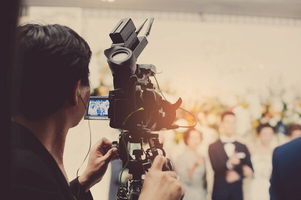 videographer close up, cameraman, movie, man with camera, movie, professional camera