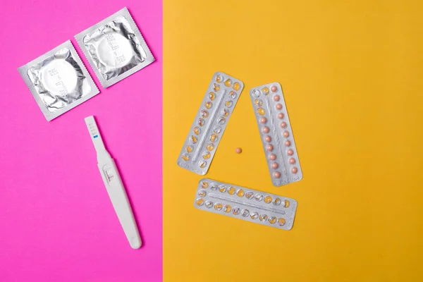 condom with contraceptive, birth control pill, safe sex