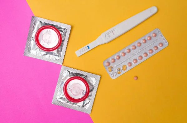 condom with contraceptive, birth control pill, safe sex