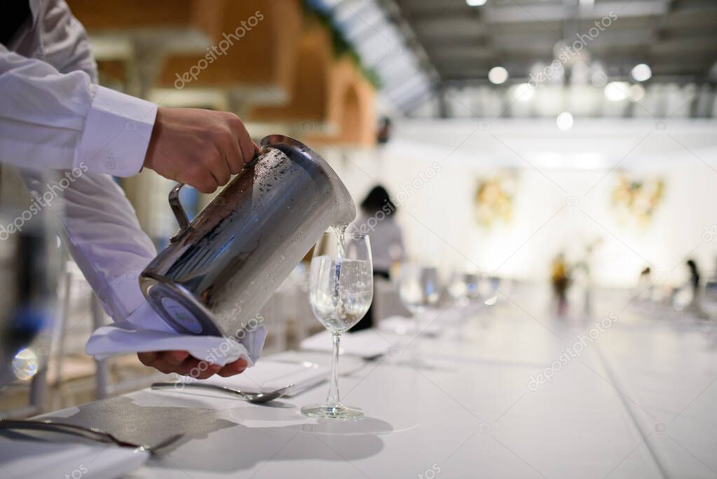 pour water, glass water, glass on table