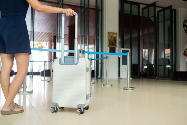 woman with luggage with blur background, suitcas