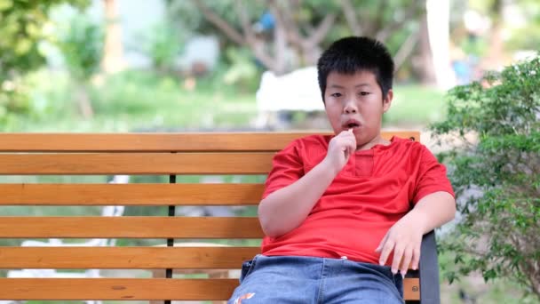 Asian Boy Eating Ice Cream Delicious Happy Concept — Stock Video