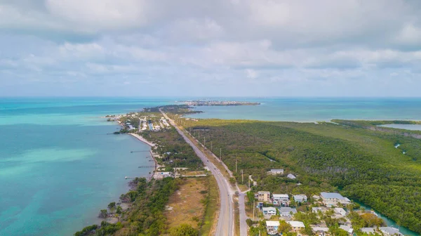 Florida Keys. Bridge or road on Key West FL. Atlantic ocean and Gulf of Mexico. Spring break or Summer vacations in Florida. Tropical nature. Aerial view.