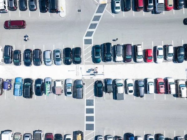 Public Parking for cars. Parking lot for car is full. Bright Sunny day. Aerial top view.
