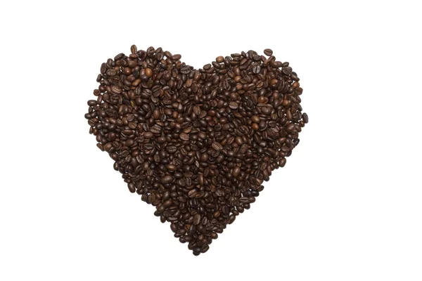 Grains de café renversés sous la forme de coeur . — Photo