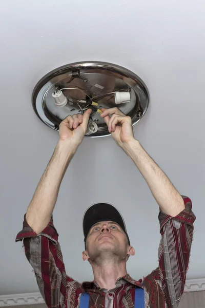 Electrical insulating contact on the ceiling lamp. — Stock Photo, Image