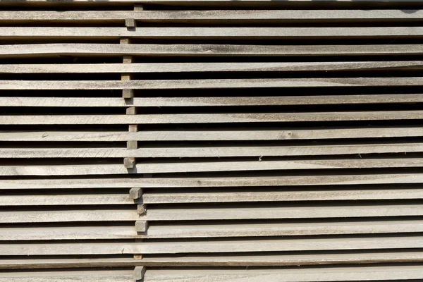 Background of a stack of drying board. — Stock Photo, Image