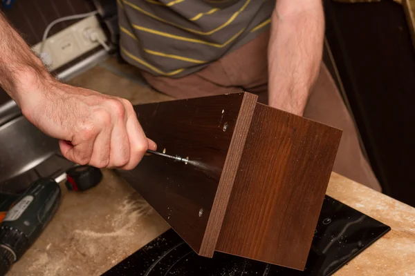 The man with the key collects furniture.