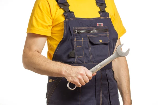 Trabajador con casco y camiseta amarilla — Foto de Stock