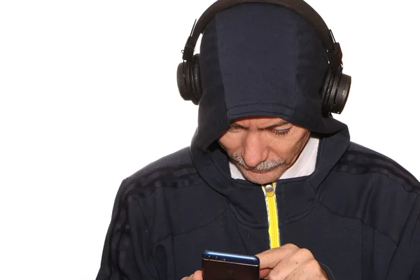 Man Sports Jacket Hood His Head Listens Music Headphones His — Stock Photo, Image