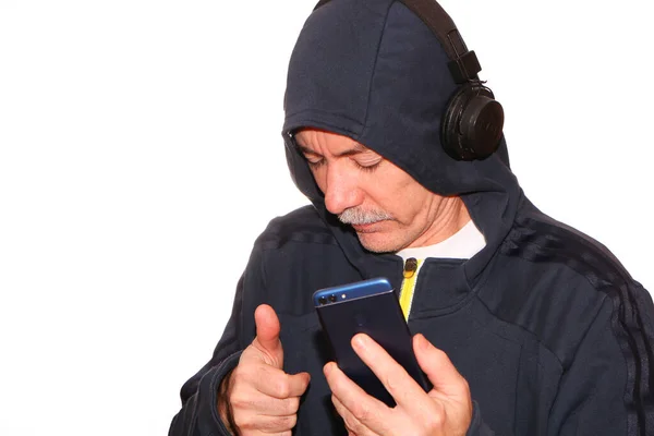 Man Sports Jacket Hood His Head Listens Music Headphones His — Stock Photo, Image