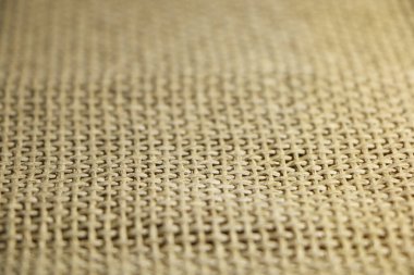 Farklı renk bazlı lifli bir kumaşın soyut arkaplanı. Çuval bezi arka planı.