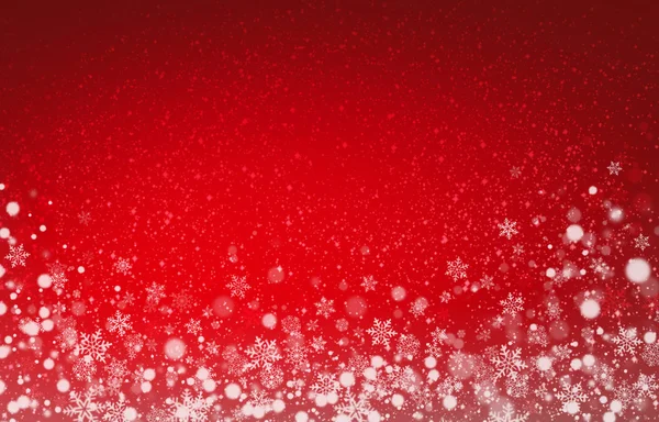 Снежинки на рождественском красном фоне — стоковое фото